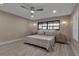 A serene bedroom features a queen-sized bed, modern decor, and plenty of natural light at 5757 Gulf Of Mexico Dr # 110, Longboat Key, FL 34228
