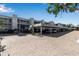 Well-maintained multi-story building featuring ample covered parking and lush landscaping, providing convenience and curb appeal at 5757 Gulf Of Mexico Dr # 110, Longboat Key, FL 34228