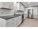 Modern kitchen with stainless steel appliances, custom backsplash, and ample counter space at 5757 Gulf Of Mexico Dr # 110, Longboat Key, FL 34228