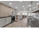 Spacious, open-concept kitchen with stainless steel appliances and stylish backsplash detail at 5757 Gulf Of Mexico Dr # 110, Longboat Key, FL 34228