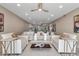 Living room featuring neutral tones, and an open view to the adjacent kitchen and dining at 5757 Gulf Of Mexico Dr # 110, Longboat Key, FL 34228