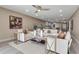 Bright living room showcasing modern furnishings and an open floor plan connecting to the kitchen at 5757 Gulf Of Mexico Dr # 110, Longboat Key, FL 34228