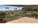 Spacious outdoor patio overlooking manicured lawns and providing serene partial views of the beautiful beach at 5757 Gulf Of Mexico Dr # 110, Longboat Key, FL 34228