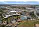 Aerial view of community buildings and amenities, including tennis courts and a pool at 618 Bird Bay S Dr # 118, Venice, FL 34285