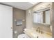 Well-lit bathroom with a stylish mirror, clean fixtures, and neutral decor at 618 Bird Bay S Dr # 118, Venice, FL 34285