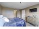 Well-appointed bedroom with soft lighting, a decorative dresser, and calming decor at 618 Bird Bay S Dr # 118, Venice, FL 34285