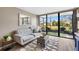 Cozy living room with stylish furnishings and sliding glass doors to a screened lanai at 618 Bird Bay S Dr # 118, Venice, FL 34285