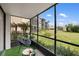 Relaxing screened porch with comfortable seating and views of the landscaped grounds at 618 Bird Bay S Dr # 118, Venice, FL 34285