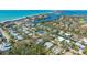Aerial view of coastal neighborhood with single-Gathering homes and access to beaches and waterways at 618 Buttonwood Dr, Longboat Key, FL 34228