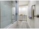 Stylish bathroom features a glass door walk in shower with updated fixtures and granite countertops on vanity at 618 Buttonwood Dr, Longboat Key, FL 34228