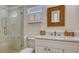 Bathroom with a tiled shower and natural decor at 618 Buttonwood Dr, Longboat Key, FL 34228