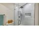 Bright shower with white tile and a seamless glass door at 618 Buttonwood Dr, Longboat Key, FL 34228