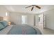 Bright bedroom with wood-look floors and doorway leading outside at 618 Buttonwood Dr, Longboat Key, FL 34228