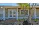 Charming home facade with well-manicured landscaping and a welcoming brick walkway at 618 Buttonwood Dr, Longboat Key, FL 34228