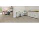 Bright living room featuring light wood floors, white furniture, and charming decor at 618 Buttonwood Dr, Longboat Key, FL 34228