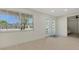 Bright living room with large windows and glass doors that let in natural light at 618 Buttonwood Dr, Longboat Key, FL 34228