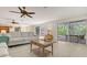 Spacious living room with neutral colors and sliding doors leading to outdoor spaces at 618 Buttonwood Dr, Longboat Key, FL 34228