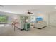 Comfortable living room with sofas, stylish decor, and access to the outdoor patio at 618 Buttonwood Dr, Longboat Key, FL 34228