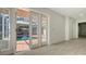 A view through french doors to the pool and covered patio at 618 Buttonwood Dr, Longboat Key, FL 34228