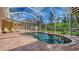 Inviting private pool area with brick paver deck, sun chairs, and lush tropical landscaping at 618 Buttonwood Dr, Longboat Key, FL 34228