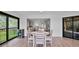 Open-concept dining area with lots of natural light and views into the living room at 6423 Egret Ln # 402, Bradenton, FL 34210
