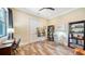 Bright office space with hardwood floors, a large window, and an easel set up for painting at 7157 Saddle Creek Cir, Sarasota, FL 34241