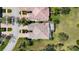 Overhead shot of villa featuring tile roof, screened lanai, and lush landscaping in a lovely neighborhood at 7623 Camminare Dr, Sarasota, FL 34238