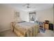 Cozy bedroom with a side table, workspace, and a large window for natural lighting at 7623 Camminare Dr, Sarasota, FL 34238