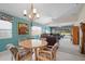 The dining area and open-concept living space are well-lit and inviting at 7623 Camminare Dr, Sarasota, FL 34238
