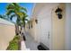 Inviting villa featuring a front door with sidelight and a well-maintained walkway at 7623 Camminare Dr, Sarasota, FL 34238