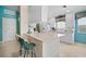 Bright kitchen with ample counter seating and a modern, minimalist design at 7623 Camminare Dr, Sarasota, FL 34238