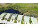 An aerial view shows the home's proximity to a pond and green space in a private setting at 8536 54Th Avenue E Cir, Bradenton, FL 34211