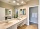 Spacious bathroom featuring double sinks, large mirrors, and modern fixtures at 8536 54Th Avenue E Cir, Bradenton, FL 34211