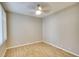 Bright bedroom featuring wood-look floors and a ceiling fan for added comfort at 8536 54Th Avenue E Cir, Bradenton, FL 34211