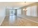 Large dining space with modern lighting and access to a screened-in outdoor area through sliding doors at 8536 54Th Avenue E Cir, Bradenton, FL 34211