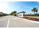 Welcome to Rosedale: a beautiful community entrance with lush landscaping and flowers at 8536 54Th Avenue E Cir, Bradenton, FL 34211