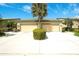 Inviting townhome with a two-car garage and a well-maintained front yard featuring a mature palm tree at 8536 54Th Avenue E Cir, Bradenton, FL 34211