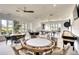 Spacious game room with poker table, billiards, and comfortable seating at 8536 54Th Avenue E Cir, Bradenton, FL 34211