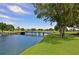 Scenic view of a golf course with a bridge over a lake at 8536 54Th Avenue E Cir, Bradenton, FL 34211