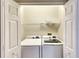Laundry closet with a white washer and dryer at 8536 54Th Avenue E Cir, Bradenton, FL 34211