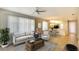 Inviting living room with a neutral color palette, ceiling fan, and lots of natural light at 8536 54Th Avenue E Cir, Bradenton, FL 34211