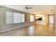 Open floorplan with wood-look tile, neutral paint and lots of natural light entering from the adjacent kitchen at 8536 54Th Avenue E Cir, Bradenton, FL 34211