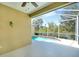 Refreshing screened-in pool overlooking a tranquil lake and lush greenery at 8536 54Th Avenue E Cir, Bradenton, FL 34211