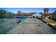 Aerial view of tennis courts with nets and green canopy at 8536 54Th Avenue E Cir, Bradenton, FL 34211