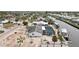 Waterfront home featuring a private dock, screened-in pool, solar panels, and waterfront access at 928 Spindle Palm Way, Apollo Beach, FL 33572
