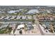 An aerial view of a waterfront neighborhood with canals and colorful homes, perfect for boating enthusiasts at 928 Spindle Palm Way, Apollo Beach, FL 33572