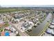 Waterfront home featuring a private dock, screened-in pool, solar panels, waterfront access and scenic views at 928 Spindle Palm Way, Apollo Beach, FL 33572