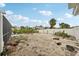 View of a large backyard needing some TLC; the possibilities are endless with this blank canvas at 928 Spindle Palm Way, Apollo Beach, FL 33572