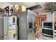 Basement featuring a refrigerator, microwave, and oven appliances at 928 Spindle Palm Way, Apollo Beach, FL 33572