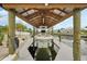 Boat lift featuring a covered structure, providing convenient and protected storage for your vessel at 928 Spindle Palm Way, Apollo Beach, FL 33572